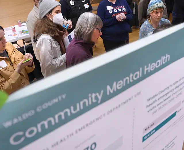 People talking and learning about community mental health